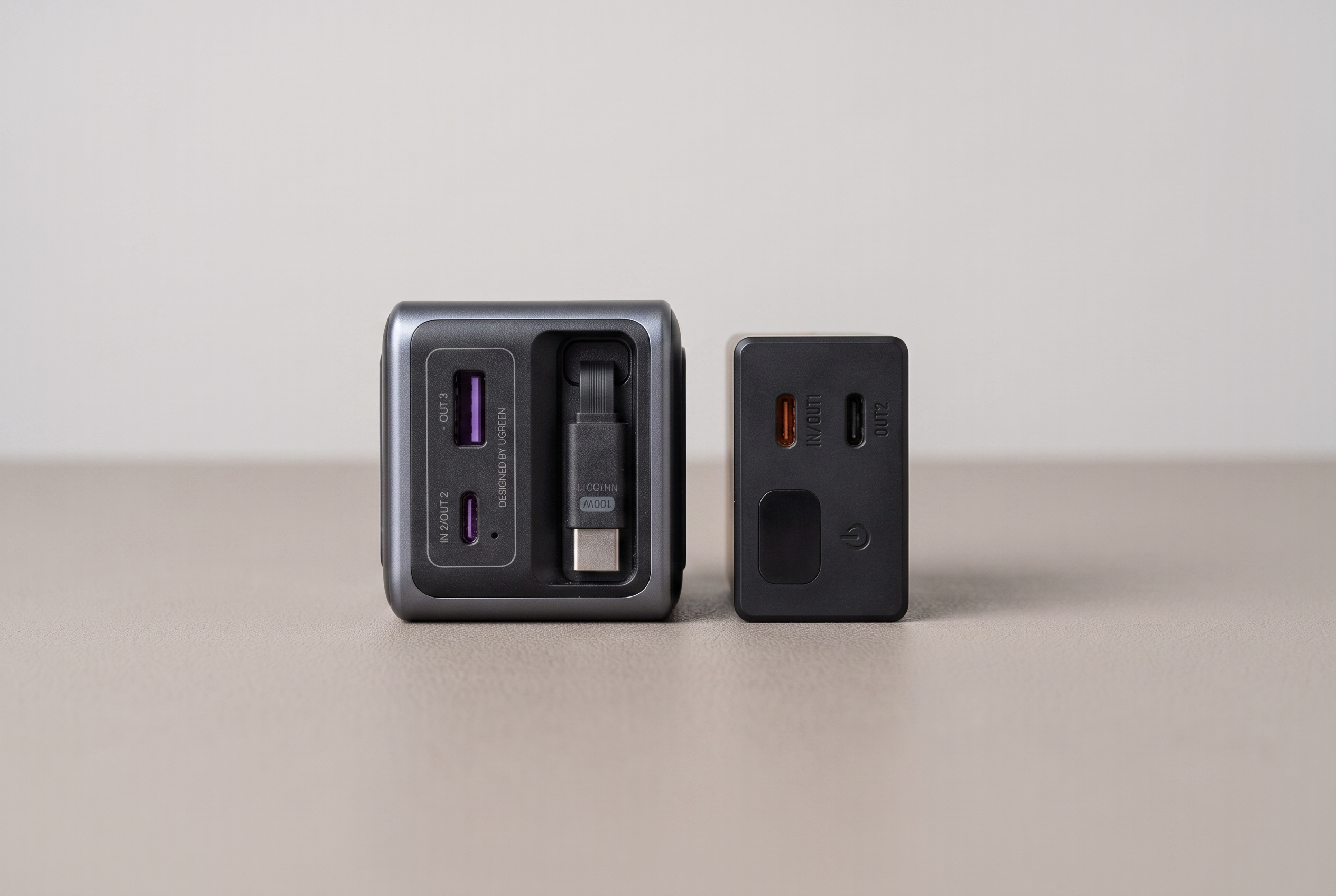 Top view of the Nitecore Carbo 20 next to the UGREEN Nexode 165 showing ports and cable